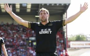 wigan pute i c tiga scut comunitar holt