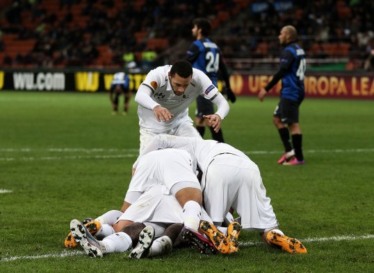 Emmanuel Adebayor’s away goal proved vital on the night as Inter Milan crashed out of the Europa League – despite thumping Tottenham Hotspur 4-1 at the San Siro.