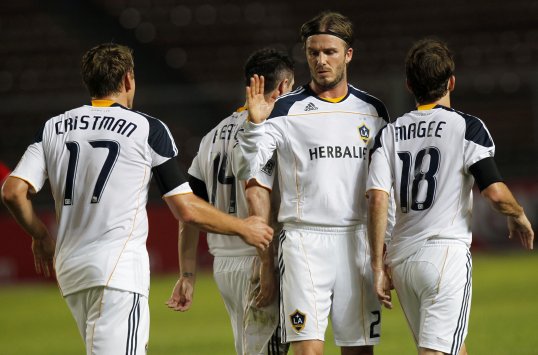 David Beckham will not retire at the end of the season, but will review his position at LA Galaxy when there is a break clause in his contract.