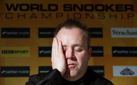 Four-time champion John Higgins suffered a shock defeat to Mark Davis to exit the first round of the World Snooker Championship at the Crucible.