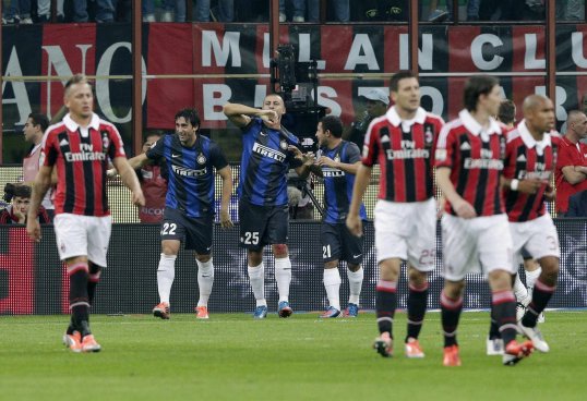 Associazione Calcio Milan have been fined €8,000 for “fan behaviour” after plastic bottles were thrown and tasteless banners were displayed around the San Siro during the Milan derby on Sunday.