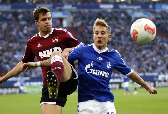 Schalke 04 midfielder Lewis Holtby has poured cold water on speculation linking him to a move to either Arsenal or Liverpool.
