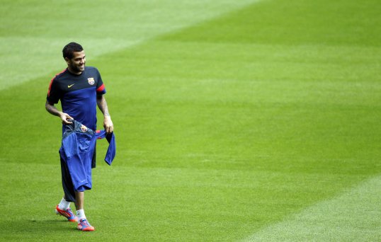 Barcelona defender Dani Alves believes it is more difficult to win La Liga than the Champions League.
