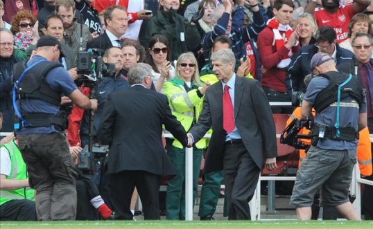 Arsenal manager Arsene Wenger believes his old rival Sir Alex Ferguson may return to football management.