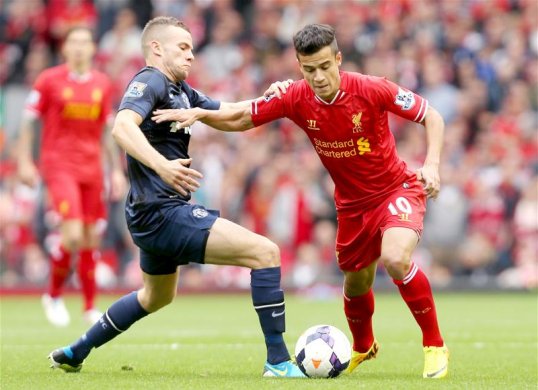 Liverpool have been forced to field youngster Jon Flanagan at right-back against Arsenal today with Glen Johnson dropping out through illness late on, though Brendan Rodgers has included the returning Philippe Coutinho on the bench.