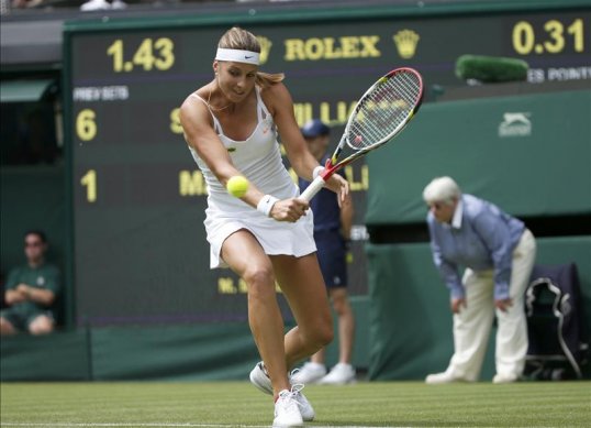 Defending champion Serena William overcame a stiff challenge from Mandy Minella to progress into the second round of Wimbledon