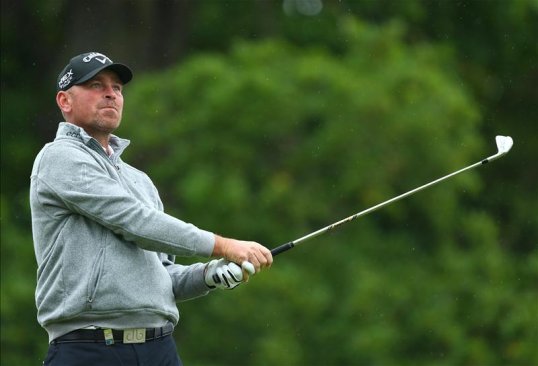 Denmark's Thomas Bjorn leads the way with a score of five under par at the French Open in Paris.
