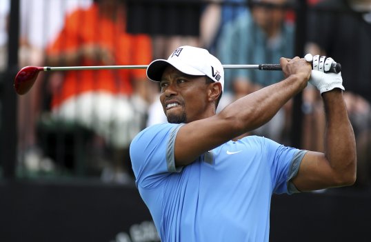 Tiger Woods missed out on a magical 59 but a nine-under-par 61 still put him in total control at the WGC-Bridgestone Invitational on Friday.