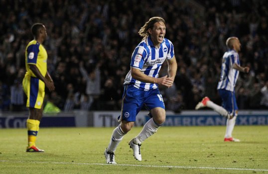 Brighton have gone top of the nPower Championship after trouncing Sheffield Wednesday 3-0 at their home ground the Amex Stadium.