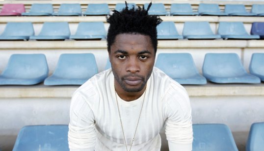 The cousin of Alex Song has claimed the midfielder is “not happy” at Barcelona.