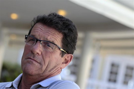 Fabio Capello has delayed signing a contract extension with the Russian national team amid reported interest from Tottenham Hotspur.