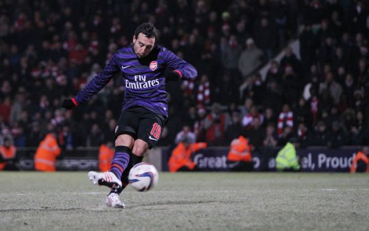 Arsenal midfielder Santi Cazorla wants to play Malaga in the Champions League.