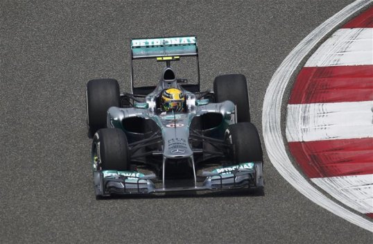 Lewis Hamilton continued his good lap times in qualifying for the Chinese Grand Prix as the Brit grabbed his first pole for his new Mercedes team.