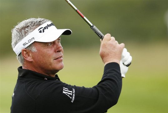 Former British Open champion Darren Clarke took a share of the lead in the China Masters in Nanshan today with a third round four-under-par 68.