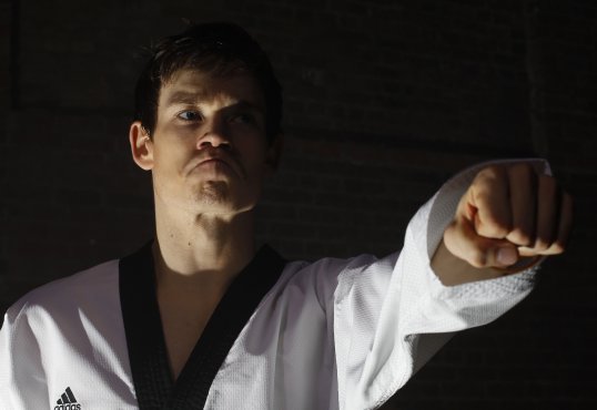 Top-ranked taekwondo fighter Aaron Cook may turn his back on Britain and compete for another country after snubbed for selection for the London 2012 Olympic Games.