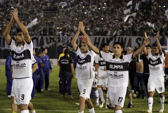 Paraguayan side Olimpia defeated Atletico Mineiro of Brazil 2-0 in the first leg of the Copa Libertadores final.