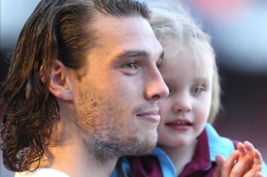West Ham United striker Andy Carroll was today heading back to his Belgian recovery clinic after suffering a minor stomach upset over the last 24 hours.