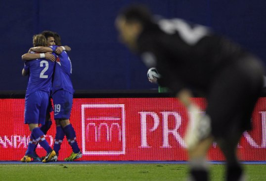Goals from Mario Mandžukić and Ivica Olić handed Croatia a vital win over bitter rivals Serbia tonight and moved them level on points with group leaders Belgium.