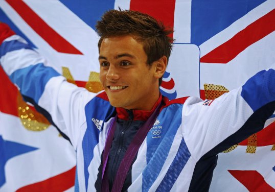 Tom Daley's mother has hit back against criticism of her son from British Swimming chief executive David Sparkes.