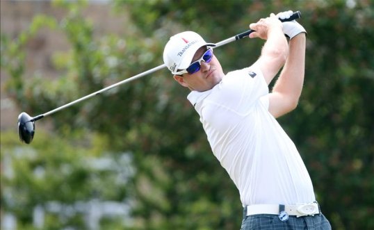 American Zach Johnson leads the Open at Muirfield after 13 holes on six-under-par.