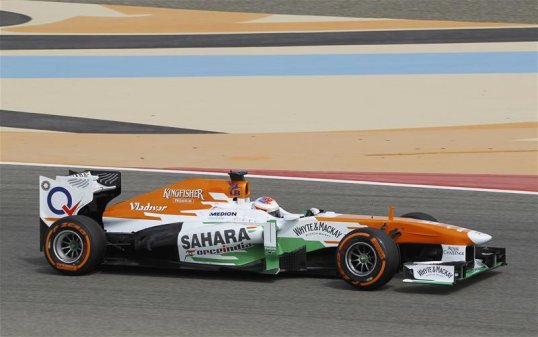 Paul di Resta and Force India’s hopes of a podium finish appear to be in doubt as Romain Grosjean’s Lotus closes the gap on the Scot at a rate of a second a lap.