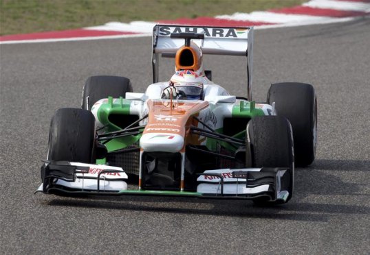 Paul di Resta loses his podium place to Romain Grosjean’s Lotus. The Scot rather politely let the Frenchman pass on the home straight.