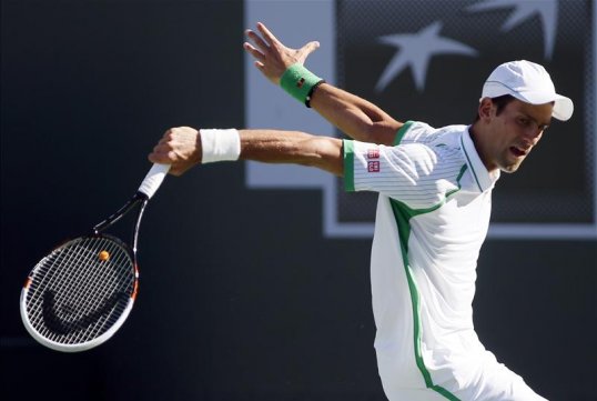 World number one Novak Djokovic overcame a difficult first set to beat Grigor Dimitrov 7-6 6-1 in the third round at Indian Wells.