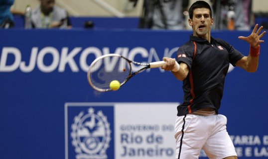 Novak Djokovic blasted past David Ferrer in the Mubadala Tennis Championship in his opening match of the season.