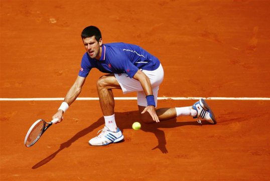 World number one Novak Djokovic has progressed into the quarter-finals of the French Open after beating Philipp Kohlschreiber.