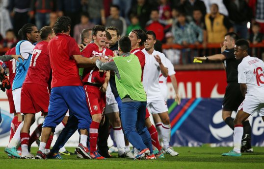 Two unidentified England Under-21 players have been charged by Serbian police for their part in an on-pitch brawl following their game in Krusevac earlier this month.