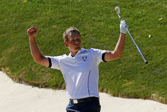 Luke Donald beat Bubba Watson 2&1 to clinch Europe’s first point of the final day of the Ryder Cup.
