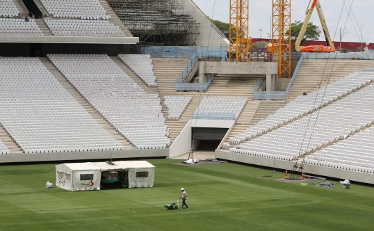 Two people have died and another has been seriously injured following the collapse of part of the stadium due to host the first game of the 2014 World Cup in Sao Paulo.