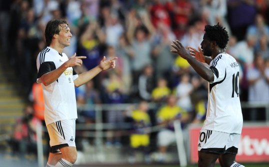 Swansea City boss Michael Laudrup has named both Wilfried Bony and Michu in his starting XI for the Europa League play-off first leg against Petrolul Ploiesti.