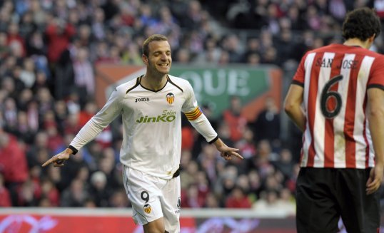 Roberto Soldado believes Valencia must improve their away form to become a genuine threat to Real Madrid and Barcelona.