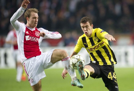 Ajax playmaker Christian Eriksen has played down, but not denied, rumours linking him with a possible move to Tottenham Hotspur.