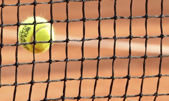 The coach of a former Wimbledon runner-up has been sentenced to eight years in prison for rape.