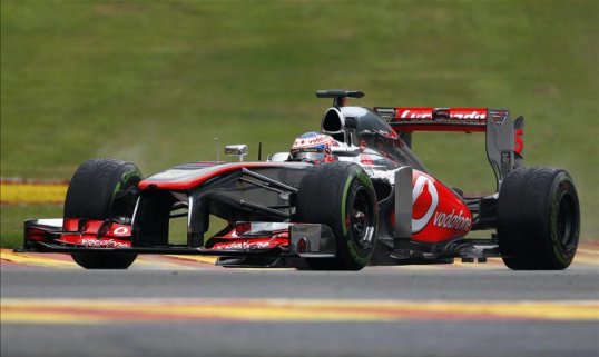 Formula One driver Jenson Button thinks McLaren need to be aiming for podium finishes starting with the Belgian Grand Prix this weekend.