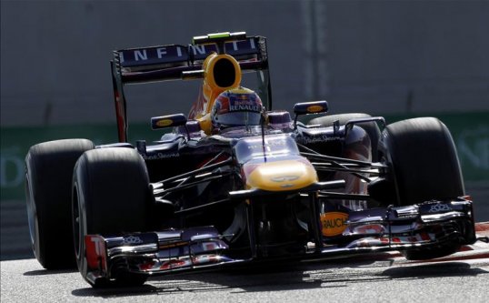 Red Bull’s Mark Webber will start from pole in the Abu Dhabi Grand Prix with teammate Sebastian Vettel in second.