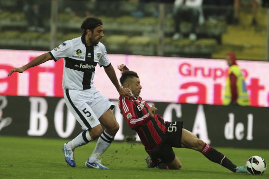 AC Milan have signed Parma defender Cristian Zaccardo with Djamel Mesbah going the other way as part of a swap deal.