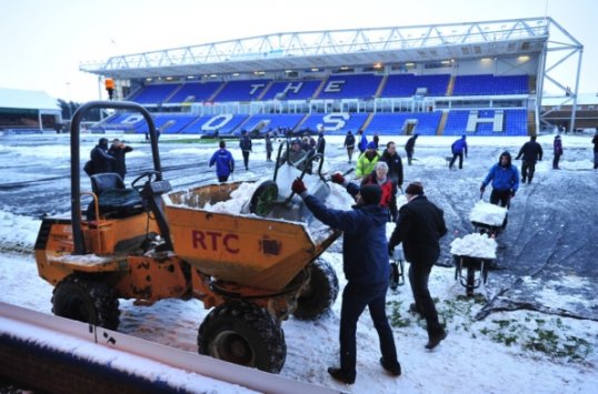 Football fans across the country have been clearing snow from football pitches in allow lower league matches to go ahead.