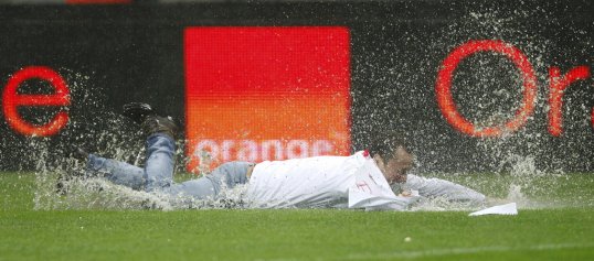Two Poland supporters face a possible three-year jail sentence for their antics on the waterlogged pitch of the delayed World Cup qualifier with England.