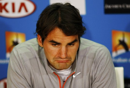 World number two Roger Federer suffered a shock defeat by Julien Benneteau at the World Indoor Tournament in Rotterdam.