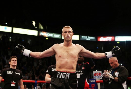 Former cricketer Andrew Flintoff has won his first professional fight against American Richard Dawson on points.