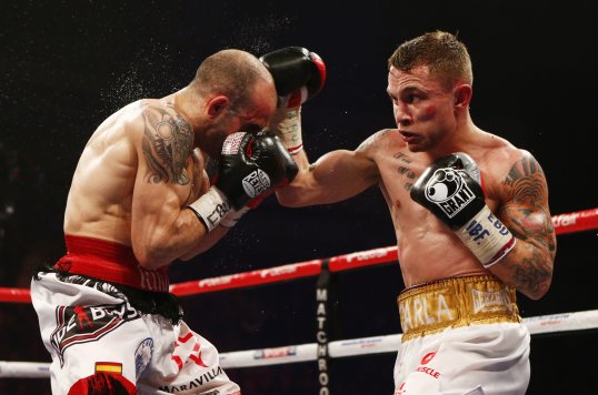 Carl Frampton won the IBF Inter-Continental and European super-bantamweight titles with a ninth-round knockout of Kiko Martinez.