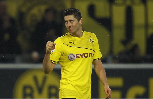 Robert Lewandowski bagged a second-half hat-trick as Borussia Dortmund thrashed Stuttgart and moved to the top of the Bundesliga table on Friday evening.