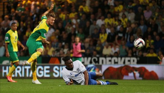 Norwich City demolished their League 2 opponents Bury to secure a place in the third round of the Capital One Cup.