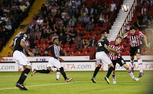 A fine headed goal from Harry Maguire gave Sheffield United a well-deserved victory over 10-man Notts County in the first Football League game of the season.