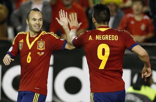 Spain sealed qualification for the 2014 World Cup with a comfortable victory over Georgia on Tuesday evening.