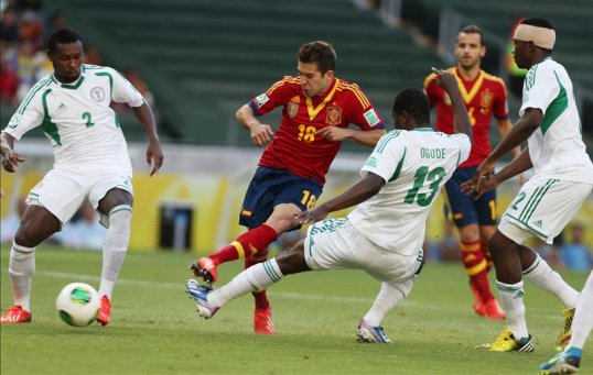 Goals from Jordi Alba and Fernando Torres helped Spain fend off the spirited challenge of Nigeria in the Confederations Cup.