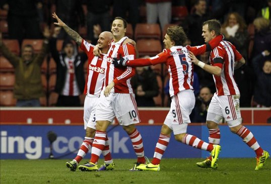 A stunning late goal from Oussama Assaidi earned Stoke City a surprise win over Chelsea on Saturday afternoon.